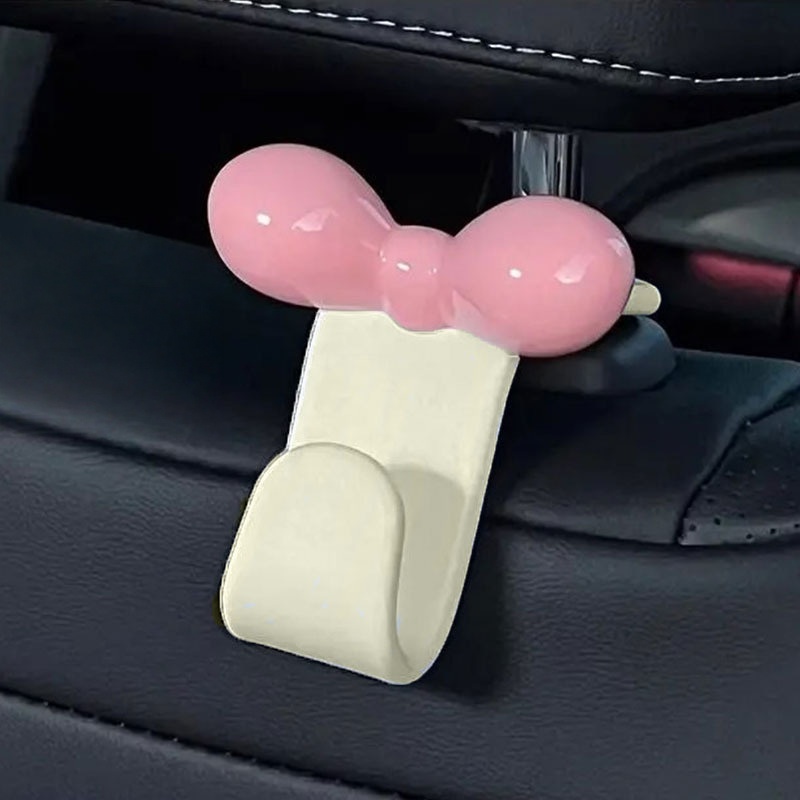 Car Seat Travel Bag - ミニマリストなボウ型車用後部座席吊り下げフック、実用的な収納アクセサリー、ハンドバッグ、軽食、車内旅行用品用